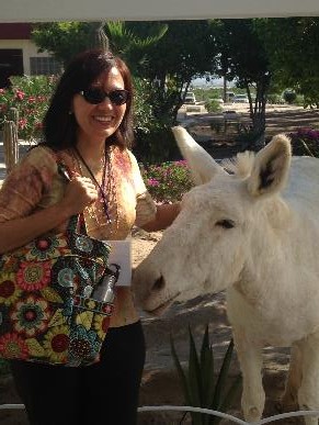 Petting an amicable white donkey that happened to be at the research facility.