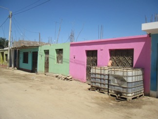 Water tanks outside a home in Ica, Peru
